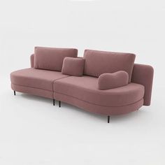 a pink couch sitting on top of a white floor