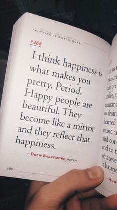 someone is holding an open book in their hand and it says, i think happiness is what makes you pretty period happy people are beautiful they become