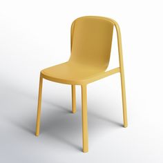 a yellow plastic chair sitting on top of a white floor