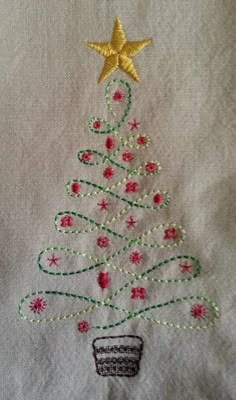 a small christmas tree on a white shirt