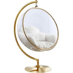 a gold metal stand with a white pillow in it and a round mirror hanging from the side