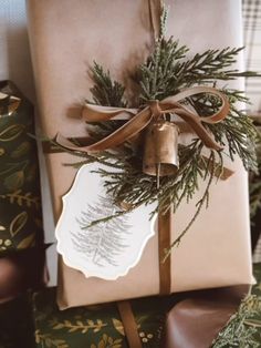 a wrapped present with a brown ribbon tied around it