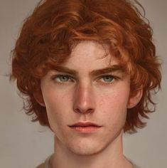 a young man with red hair and blue eyes looks at the camera while wearing a white shirt