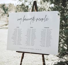 an easel with a sign that says our favorite people on it in front of some trees