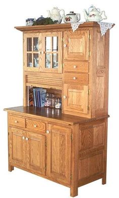 a wooden china cabinet with glass doors and drawers on it's sides, in front of a white background