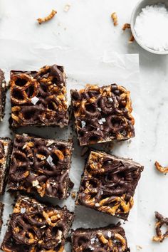 chocolate and pretzel bars on a sheet of parchment paper