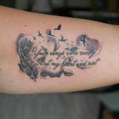 a person with a tattoo on their arm that says your wings were ready but my heart went out