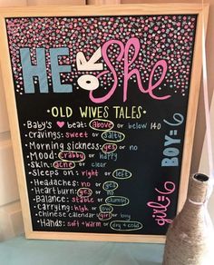 a chalkboard sign with the words he she old wives tales written in pink and blue