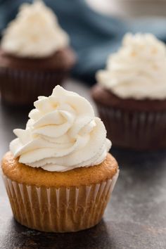 cupcakes with whipped cream on top and the words, stabilized whipped cream