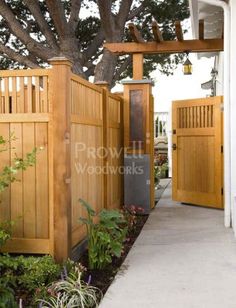 an entrance to a home with wooden gates