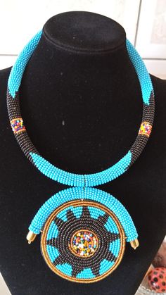 ON SALE African Light Blue Necklace African Jewelry African | Etsy Turquoise And Black Beads Necklace For Jewelry Making, Traditional Blue Beaded Jewelry, Blue And Black Beads Bohemian Necklace, Traditional Blue Beaded Necklaces, Bohemian Blue And Black Beaded Necklaces, Traditional Blue Handmade Choker, Bohemian Blue Round Beads, Blue Beaded Chain Bib Necklaces, Blue Beaded Chain Bib Necklace With Round Beads