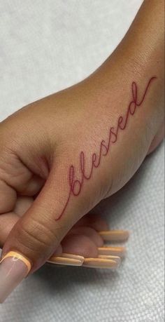 a woman's hand with the word beware written on it, in cursive writing