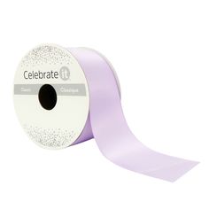 a roll of purple satin ribbon with sparkles on the edge and an inscription that reads celebrate