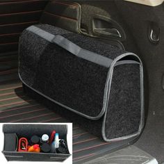 the interior of a car with an open trunk compartment and various items in its holder