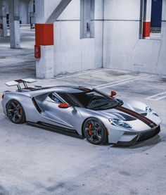 a silver sports car parked in a parking lot