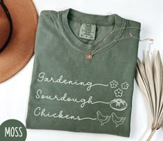 Celebrate your farming and homesteading lifestyle with our unique shirt design! Perfect for gardeners, sourdough bakers, and chickens enthusiasts alike, this shirt is a stylish and versatile addition to your wardrobe. Made from high-quality materials, it's comfortable for all-day wear.  Please feel free to message me if you have any questions. S H I R T ~ I N F O ✔ Unisex Garment-Dyed T-shirt from Comfort Colors® ✔ 100% ring-spun cotton. Made using 100% US cotton that is ethically grown and harv Cricket Shirt Ideas, Bread Shirt, Unique Shirts Design, Gardening Shirt, Shirt Company, Chicken Shirts, Gardening Shirts, Unique Shirt, Printing Machine