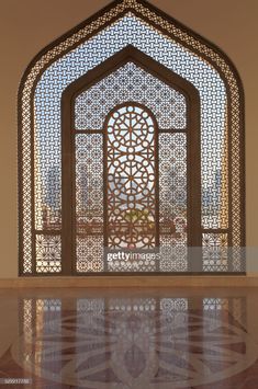 an ornate window in the middle of a building