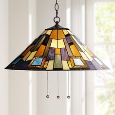 a stained glass lamp hanging from the ceiling