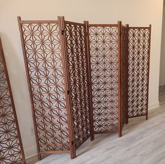 a room divider made out of wood with an intricate design