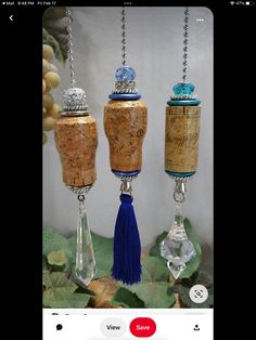 three wine corks with tassels hanging from them