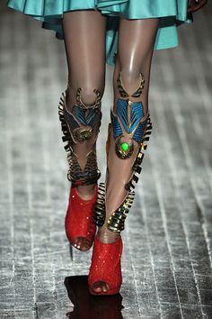 This is an Indian designer who presented at Paris in 2013. His stuff is incredible - details, just from a world that is definitely exquisite, ornate, dowsed in hues we dip our toes into when feeling saucy. look at the whole collection. im just going to give you this superhero lady leg for now.  manish arora f11 Leg Jewelry, Manish Arora, Cat Walk, Manish, Dolce E Gabbana