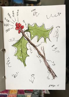 a drawing of a holly leaf with a red bow on it