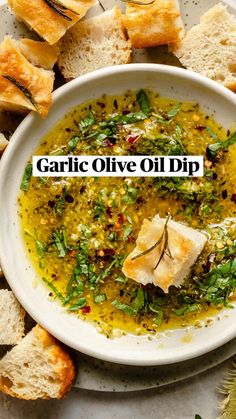 a white bowl filled with olive oil and bread