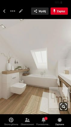 an image of a white bathroom with wood flooring and skylights on the ceiling