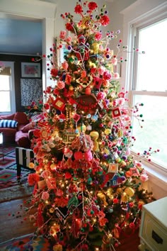 a brightly colored christmas tree in a living room