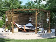 a hammock hanging from a pergolated area with potted plants on the side