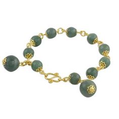 Adorn your wrists with timeless jade! Somluck Komolmith of Thailand handcrafts this beautiful design. Combining 18k gold plated brass with cool gemstone globes her bracelet features jade beads and a hook clasp. Gold Agate Bracelet With Gemstone Beads, Gold Agate Bangle Bracelet, Gold Agate Gemstone Beaded Bracelets, Gold Agate Gemstone Beaded Bracelet, Gold Agate Beaded Bracelets With Gemstones, Gold Jade Bangle Bracelet, Gold Jade Bracelets With Natural Stones, Elegant Round Aventurine Jewelry, Spiritual Jade Bracelet Jewelry