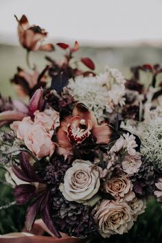 a bouquet of flowers sitting on top of a table