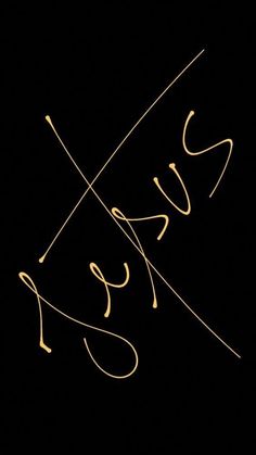 the word jesus written in cursive writing on a black background with gold lines