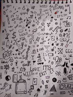 a notebook covered in lots of doodles and writing