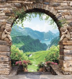 an open stone arch with flowers and mountains in the background, looking out onto a valley