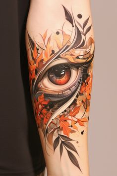 a woman's arm with an eye and leaves on it, painted in orange