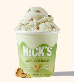 an ice cream with nuts in it on a white background and the words nick's swedish pistach