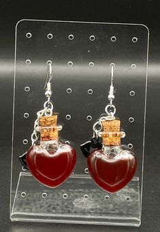 For all those vampire lovers out there or you just want to get into the spooky season, these blood vile earrings are for you.  They are heart shaped glasses filled with blood colored oil and topped off with a vampire lip charm. When getting the earrings, the dye will settle and will have to be shaken to get back to normal Blood Infused Jewelry, Vampire Lovers, Vampire Lips, Vampire Blood, Heart Shaped Glasses, Jewelry Halloween, The Dye, Halloween Jewelry, Girls Jewelry