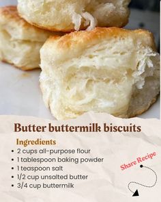 two buttermilk biscuits are sitting on top of each other