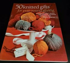 the book is about 50 knitted gifts for year - round knitting, with balls of yarn and ribbons