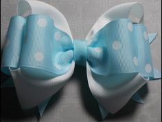 a blue bow with white polka dots on it