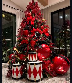 a christmas tree decorated with red and black ornaments