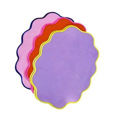 four different colored paper plates on a white background