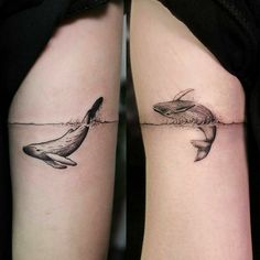 two tattoos on the legs of people that have dolphins swimming in water and one is holding a dolphin's tail