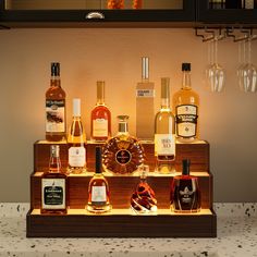 an assortment of liquor bottles and glasses on display