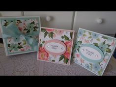 three cards with flowers on them, one has a thank you tag and the other has a bow