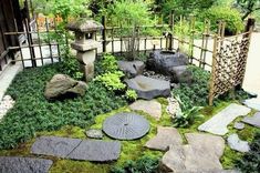 a japanese garden with rocks and grass