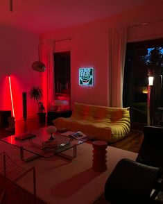 a living room filled with furniture and red lights