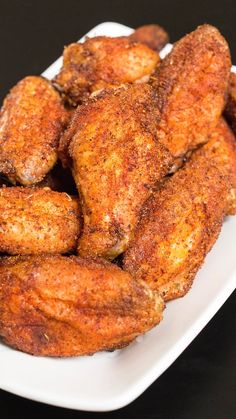 fried chicken wings on a white plate ready to be served for dinner or desserts