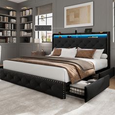 a bedroom with a bed, bookcases and desk